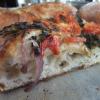 Focaccia with pesto, red onion and cherry tomato